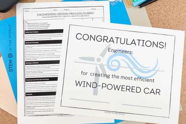 This image shows a grading rubric and a student certificate for the Wind-Powered Car STEM Challenge.
