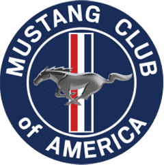 Classic Ford Mustang at Mustang Week event in front of Mustang Club of America logo.