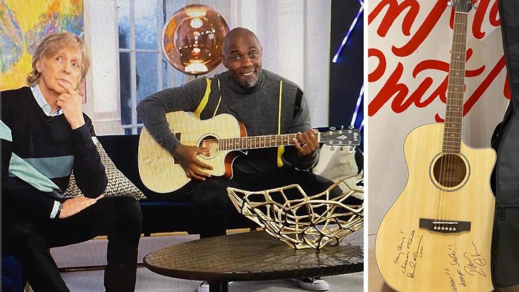 Sir Paul McCartney and Sir Idris Elba playing a guitar