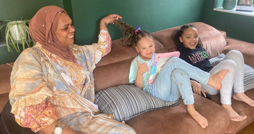 Marie Hanson at home with her grandchildren