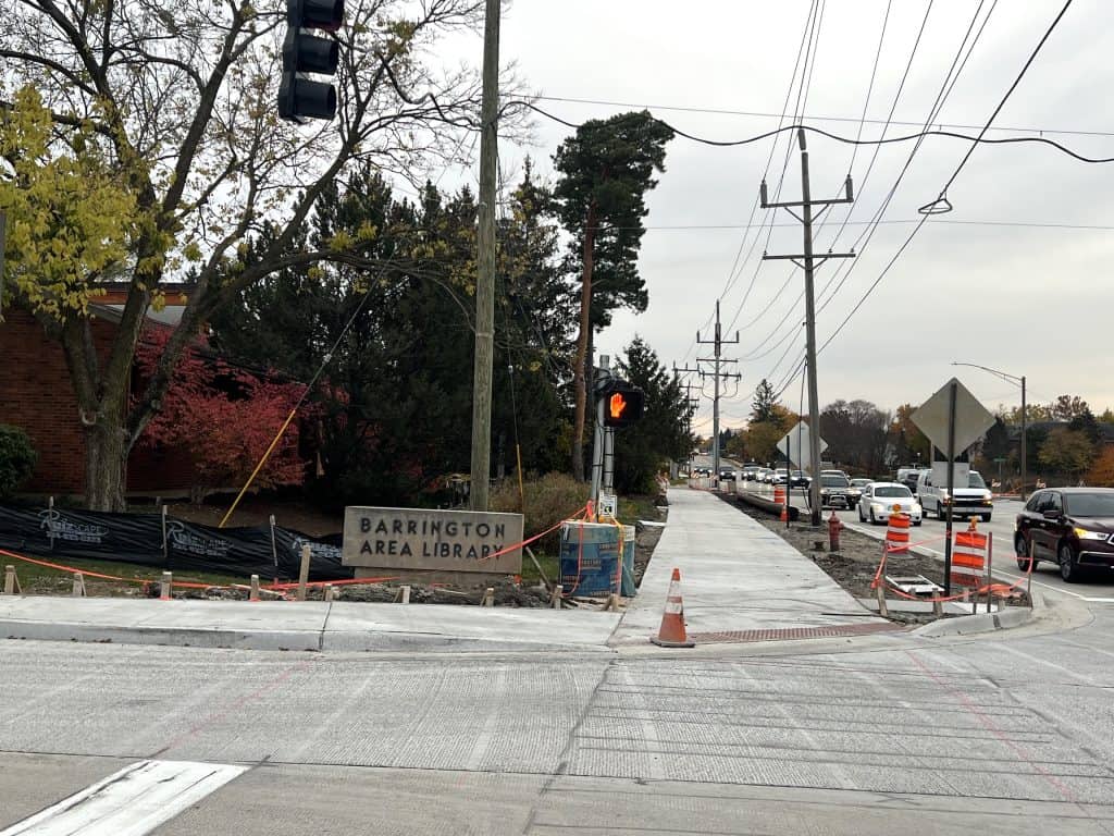 Construction sidewalk in Barrington Area Library neighborhood, suburban Chicago biking scene.