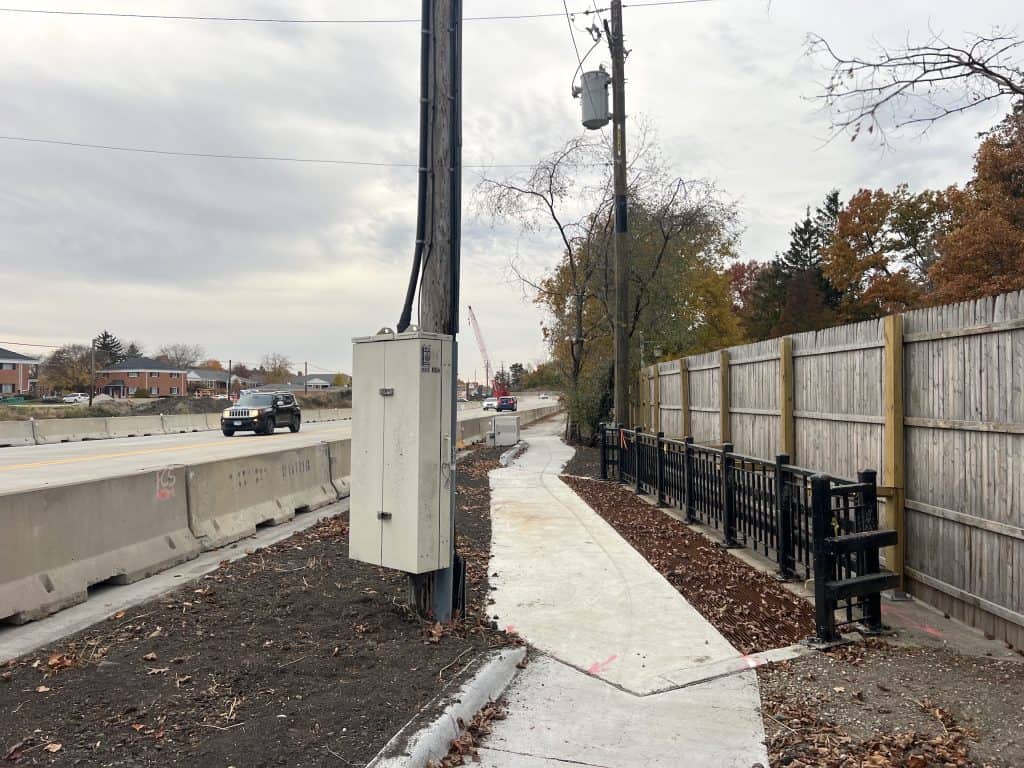 Freshly constructed suburban Chicago bike trail with smooth concrete pathway.
