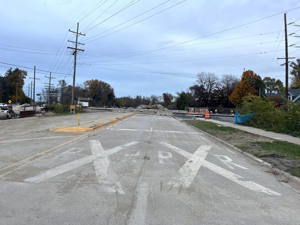 Ongoing road construction on suburban Chicago bike paths and streets during daytime.