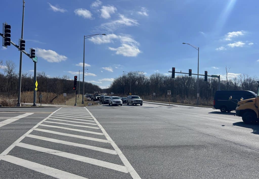 Intersection with traffic lights and street crossing near Tinley Creek trails.