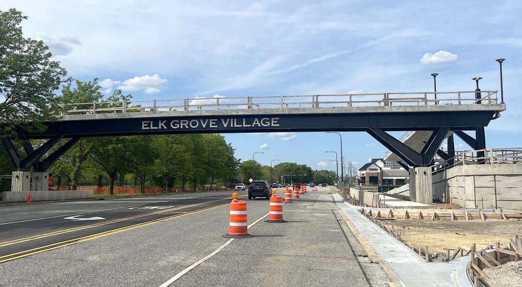 ELK GROVE VILLAGE bridge over road with traffic cones and trees in suburban Chicago.