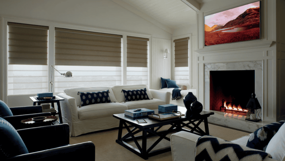 Sun shades window fashions beige and white roller blinds, cozy living room, modern window coverings for sunlight control.