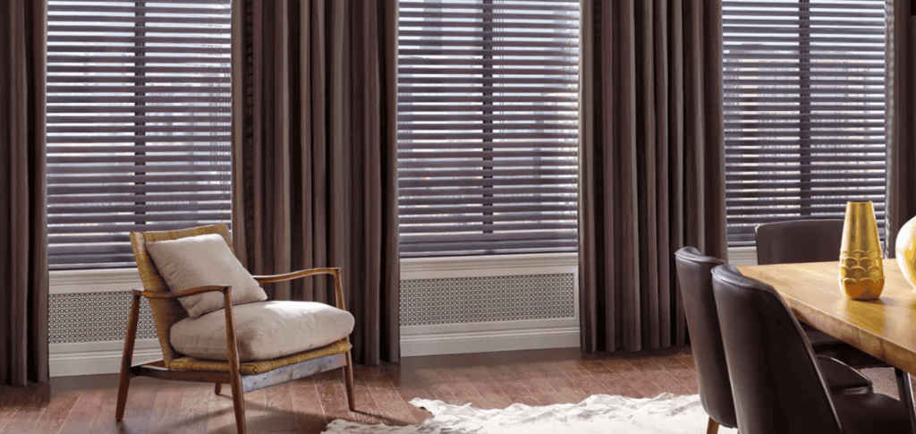 Blackout window shades with wooden blinds for sun control and privacy in living spaces.