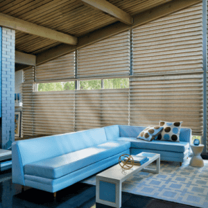 Sun shades window fashions with beige woven shades in a modern living room setting, providing stylish sun protection.