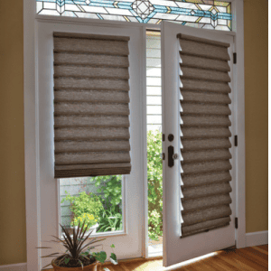 Sun shades window fashions with beige layered roman blinds in a bright room, enhancing privacy and style.