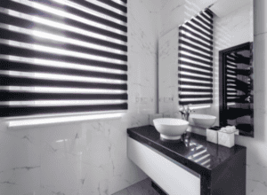 Modern bathroom with black and white sun shades window fashions, sleek and stylish window coverings.