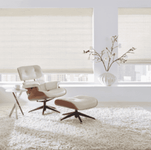 Modern sun shades window fashions in a stylish living room with large windows and white window coverings.