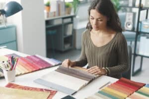 Color fabric samples for sun shades window fashions and window coverings at design studio.
