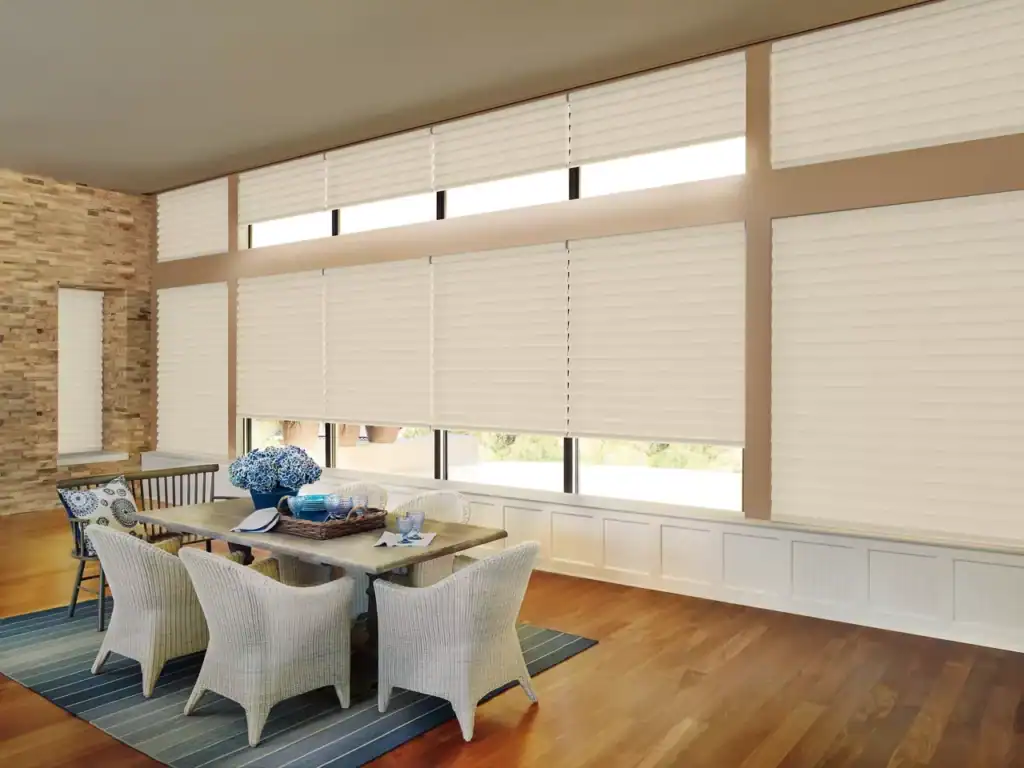 Modern beige sun shades window fashions with ocean view, ideal for enhancing natural light control.