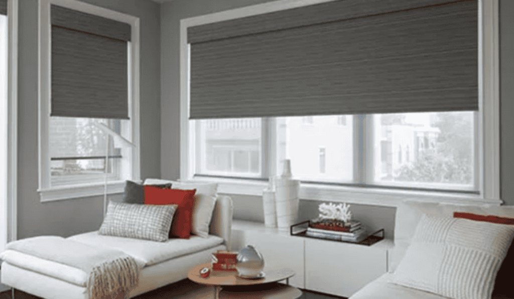 Retractable sun shades on a modern outdoor patio, providing shade and privacy.