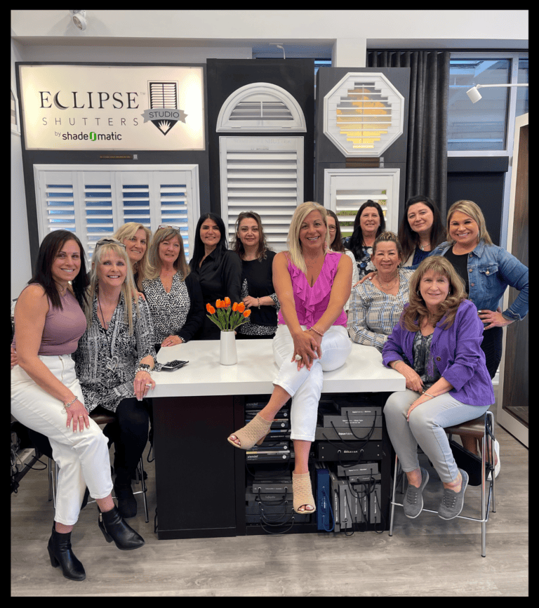 Sun shades window fashions display at Eclipse Shutters showroom with a team of interior design experts.