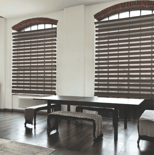 Light-filtering vertical blinds in a modern bedroom setting.
