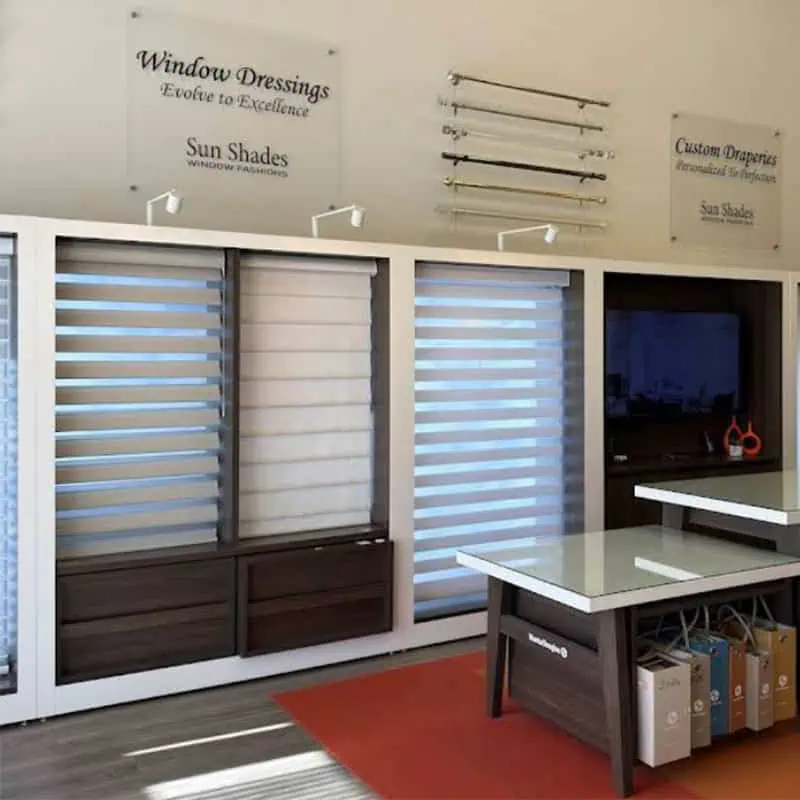 Showroom display of window dressings and blinds in Sherwood Park, featuring various styles and colors for home and office window treatments.
