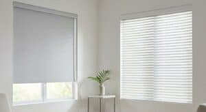 Bright white window blinds with natural light, minimalistic interior decor, small side table with green plant, contemporary home design, clean and airy living space, modern window treatment, simple decor elements, cozy and bright atmosphere, stylish window coverings, interior design aesthetics.