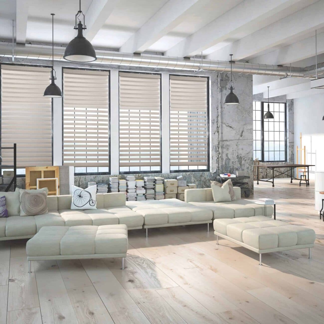 Spacious industrial-style living room featuring large windows with blinds, a white sectional sofa, and a mix of modern and vintage decor elements. Bright, airy, and stylish interior design.