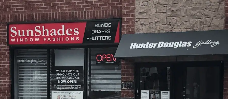 Exterior view of SunShades Window Fashions store in Newmarket, showcasing window blinds, drapes, and shutters.