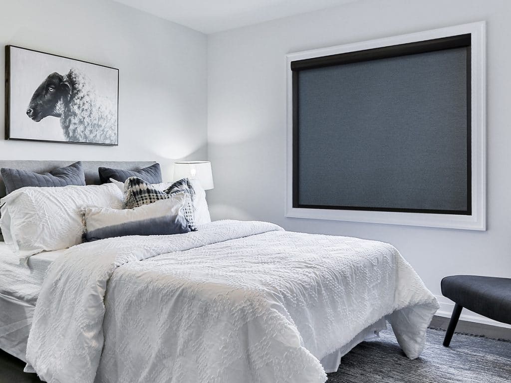 Norman LightGuard 360 blackout blinds installed in a modern bedroom