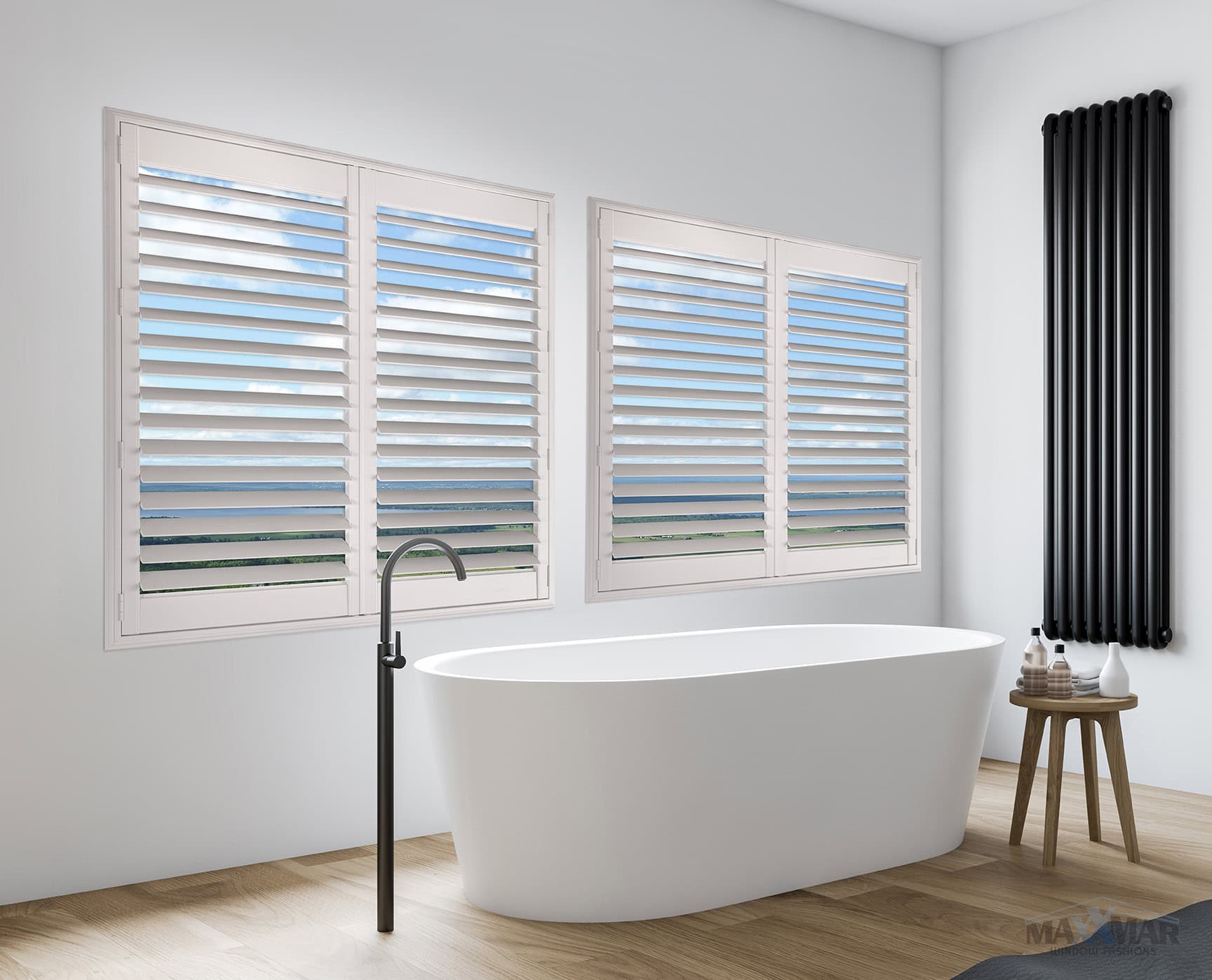 Bright bathroom featuring three white window shutters, a sleek black radiator, and a minimalist freestanding bathtub with a small wooden stool.