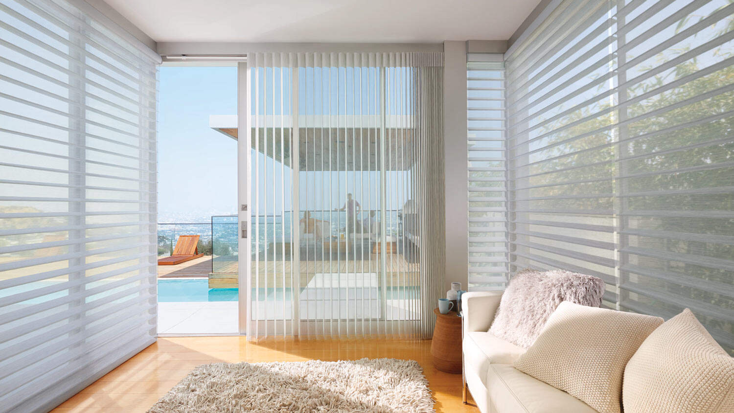 Smooth white vertical blinds covering large glass sliding door, enabling light control and privacy, ideal for modern homes with patio and living rooms.