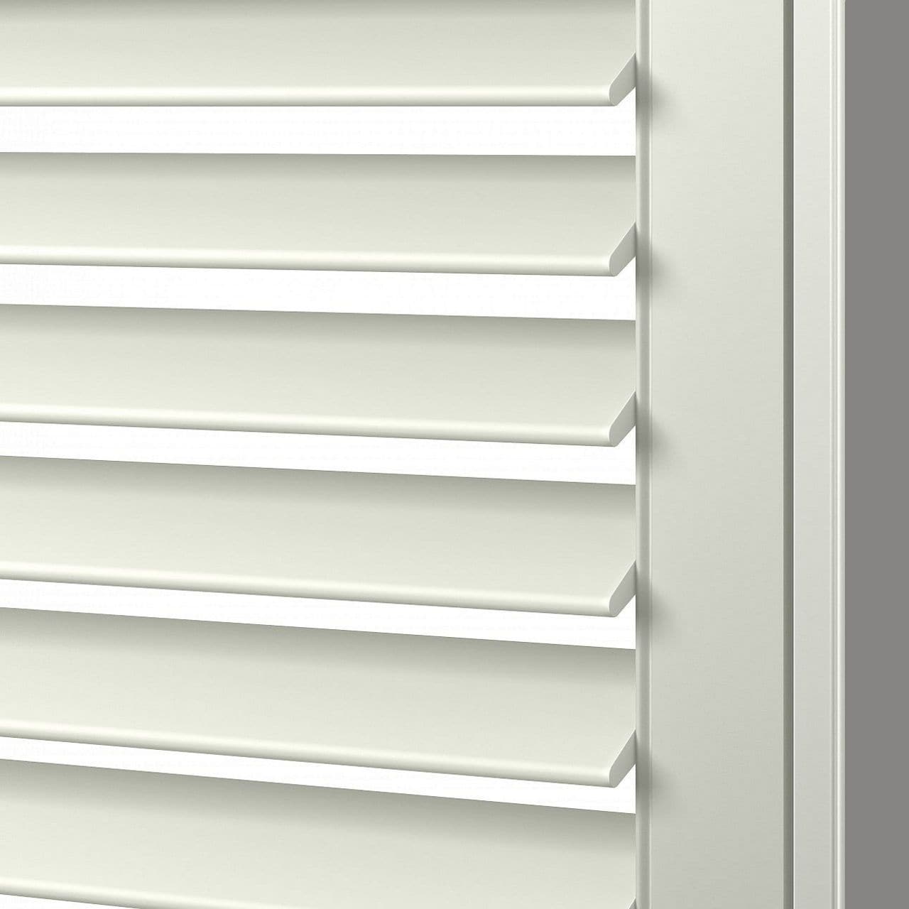 Close-up of white wood plantation shutters with adjustable louvers, ideal for window privacy and light control in home decor.