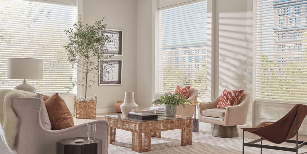 Luxury blinds in a bright living room with large windows and natural sunlight, showcasing stylish window treatments for home decor and privacy enhancement, high-quality window coverings from Superior Blinds.