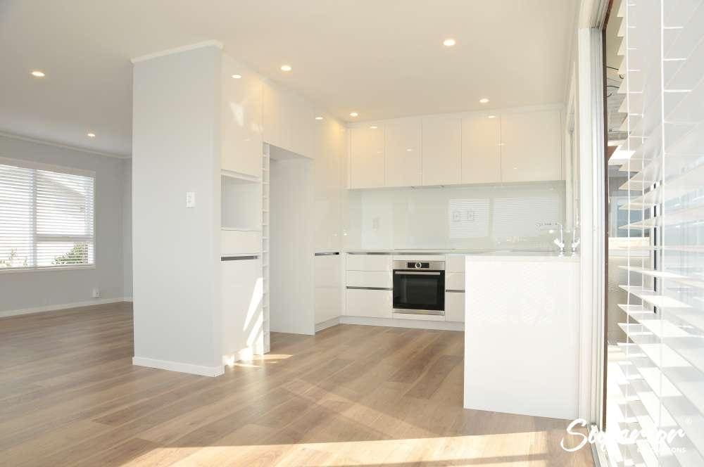 SRR_9200-1000 Open-plan kitchen and living area after a full house renovation in Milford, North Shore