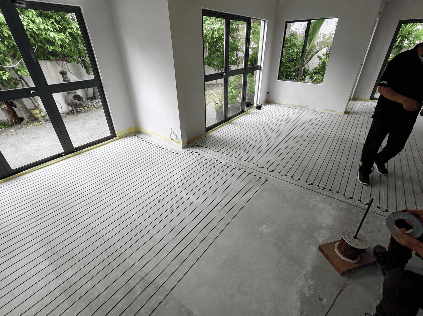 underfloor heating being applied epsom auckland - Superior Renovations