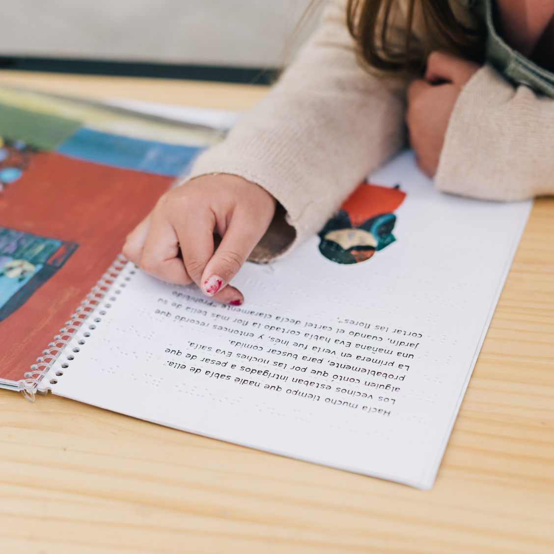child pointing to book child pointing to book