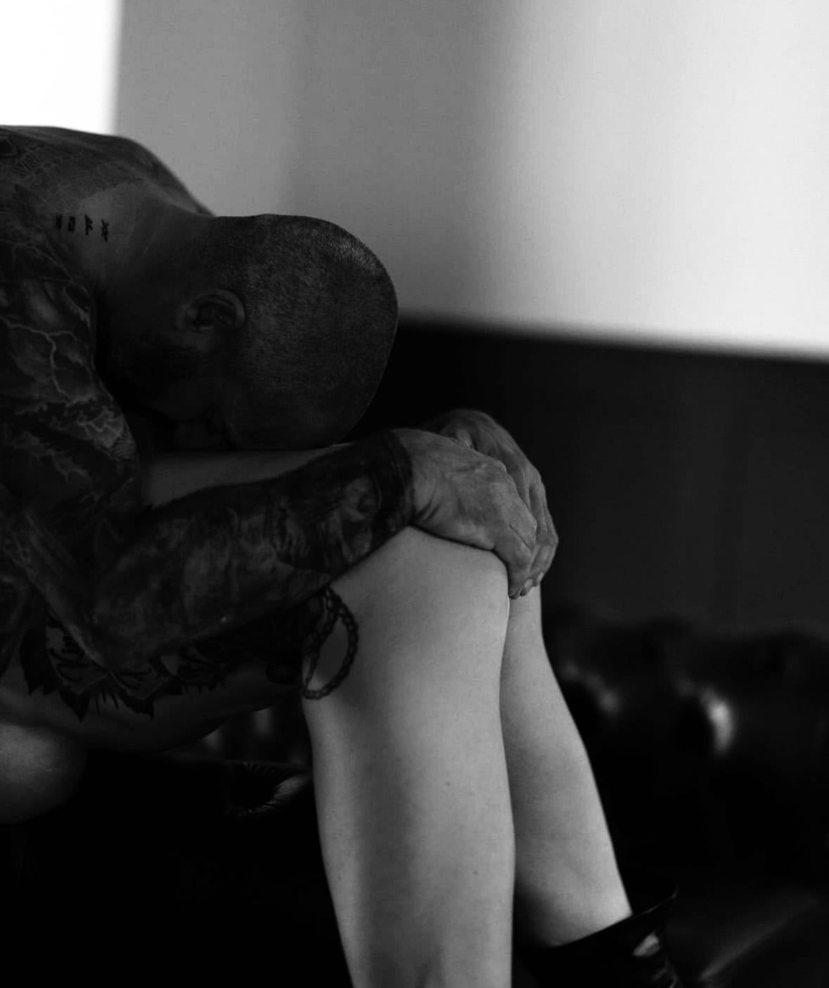 Couple sharing a passionate moment, representing physical connection and desire in a relationship.