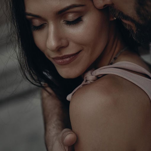 Close-up of a couple sharing a tender, intimate moment, symbolising emotional connection and relationship closeness.