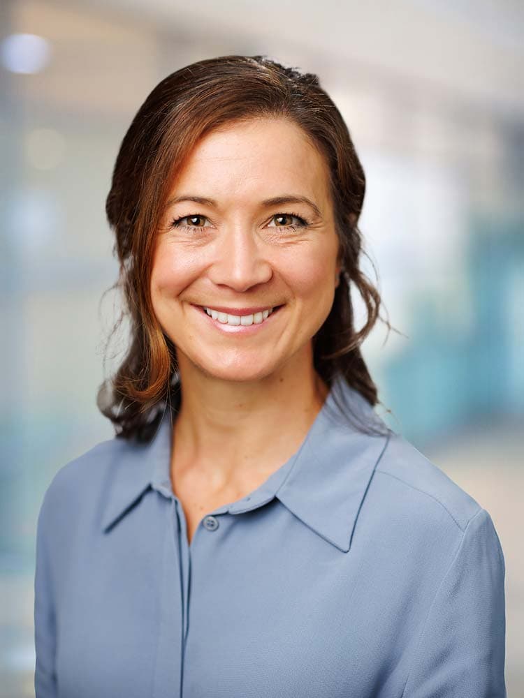 Professional headshot of a woman in business attire for Sussex headshots, portraying confidence and approachability for corporate or personal branding.