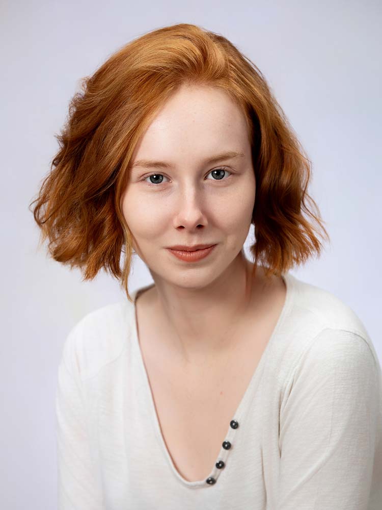 Elegant redhead woman headshot for professional Sussex headshots and corporate photography.