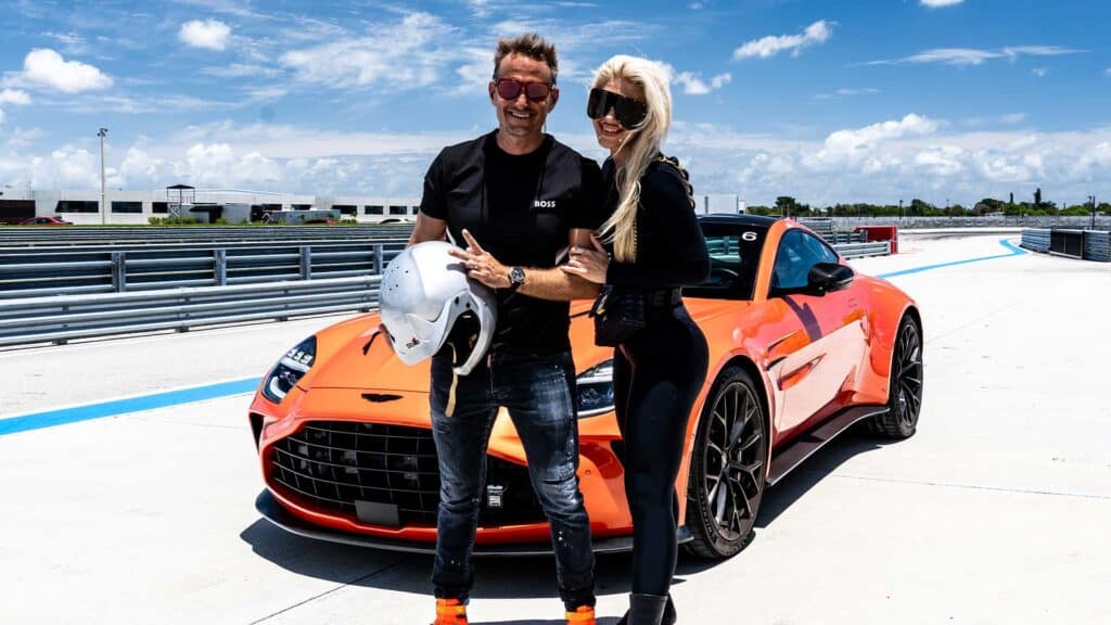 High-performance sports car and drivers at racetrack, luxury driving experience, automotive racing, speed and performance, exotic car, car enthusiast, car racing event, automotive lifestyle, supercars, track day.