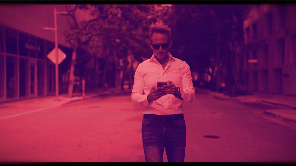 Innovative business solutions by Syslo Ventures, showcasing a modern entrepreneur using a smartphone in an urban environment for digital connectivity and tech-driven growth.