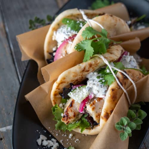 Greek Chicken pita with tazitiki and feta wrapped with string