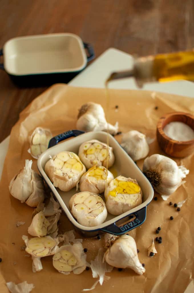 Drizzling Olive Oil on Garlic