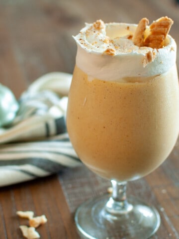 Pumpkin Milkshake with Whipped cream and pie crust crumbles