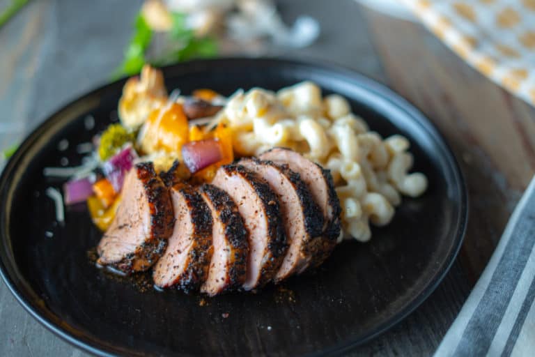 Pork Tenderloin Plated with Mac & Cheese, and Smoked Veggies