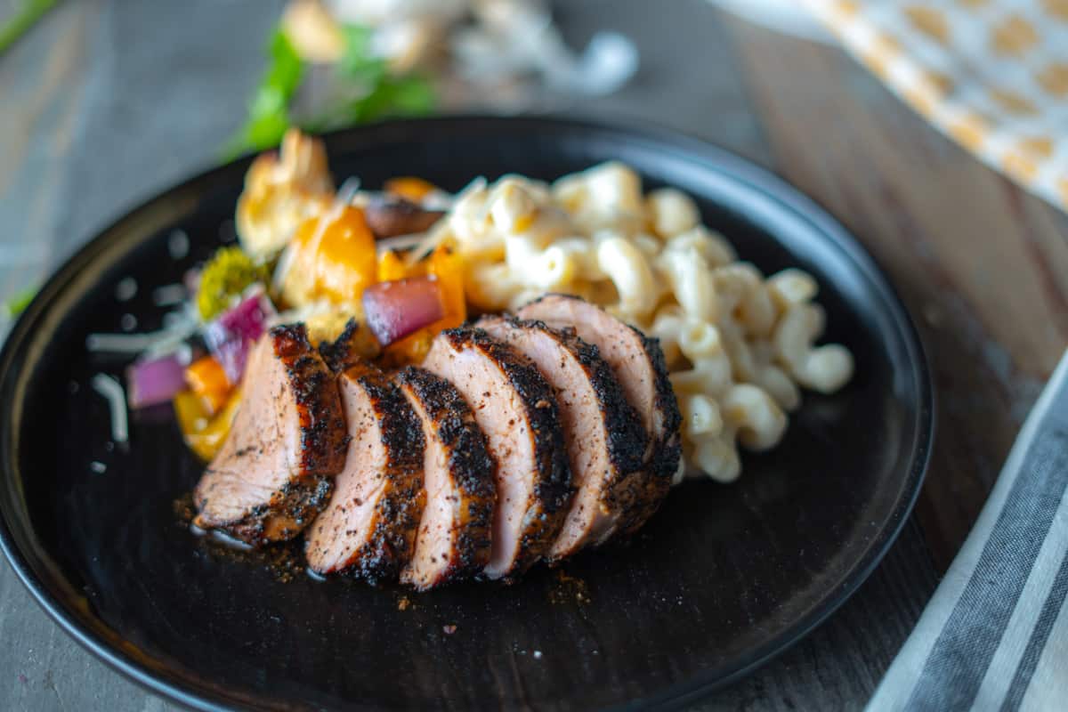 Pork Tenderloin Plated with Mac & Cheese, and Smoked Veggies