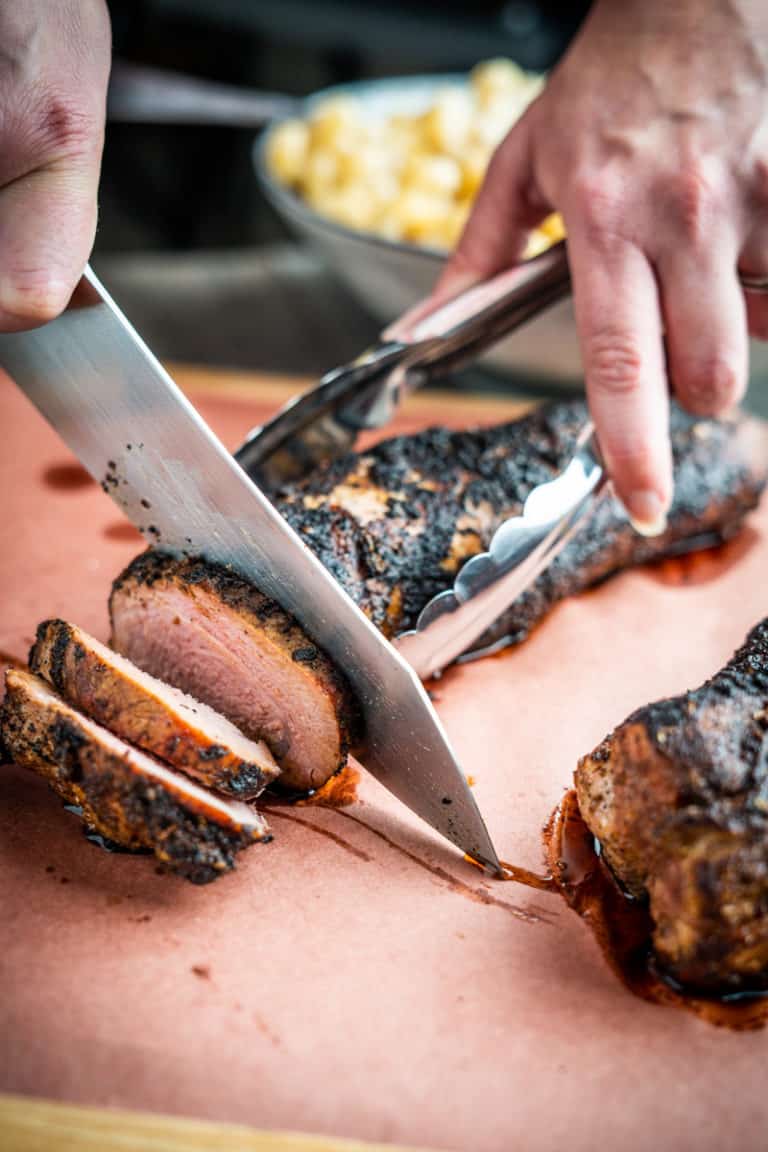 Pork Tenderloin being Sliced.