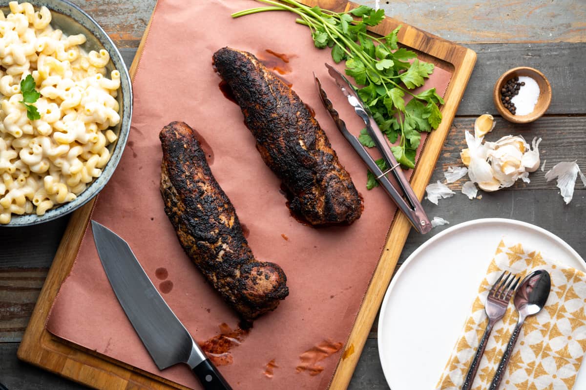 Searing Pork Tenderloin Resting on a Cutting Board before Slicing