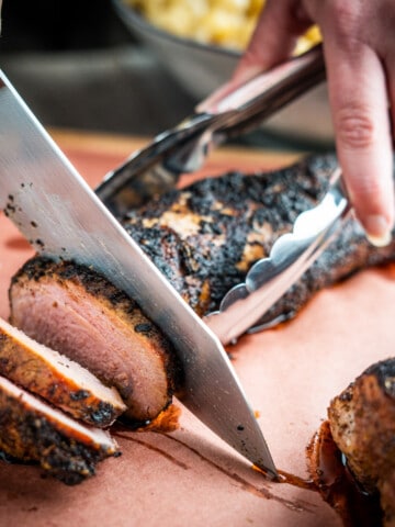 Smoked Pork Tenderloin being sliced