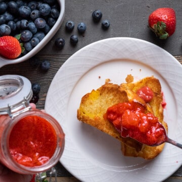 Strawberry Compote being spooned onto brioche toast