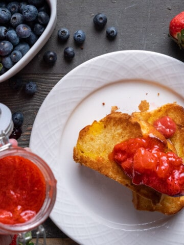 Strawberry Compote being spooned onto brioche toast