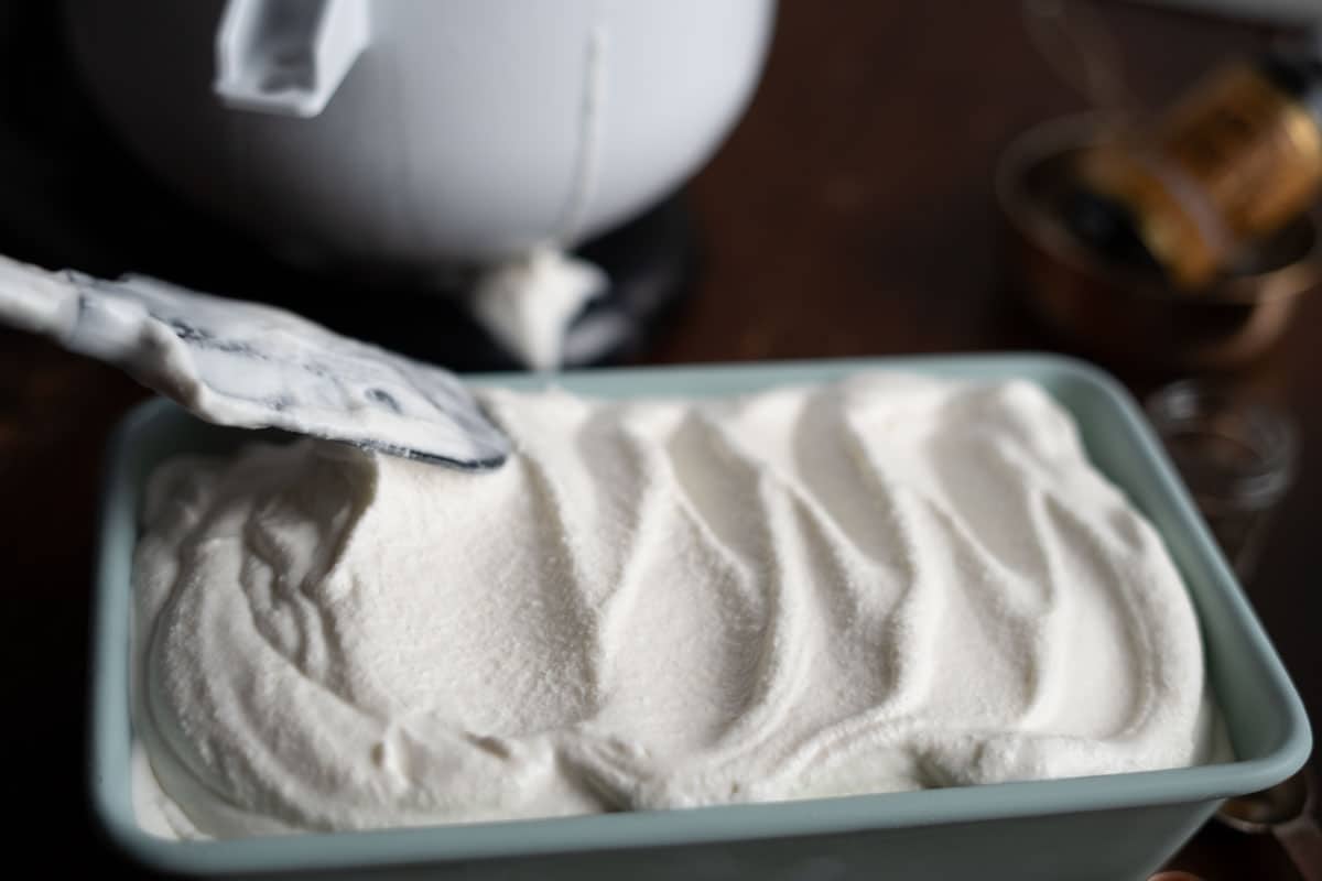 smoothing out ice cream in a pan