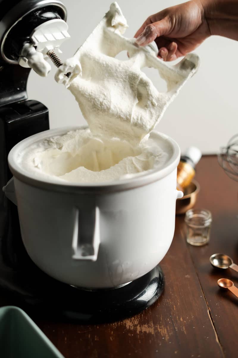 removing the churning attachment from the finished ice cream